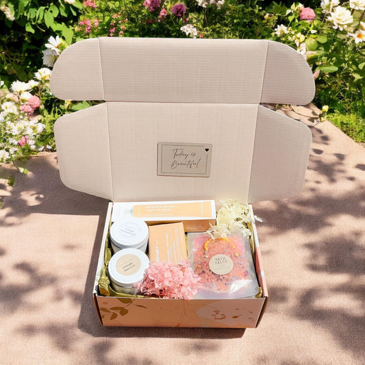 Beautifully presented spa gift pack containing gorgeous selfcare products such as body lotion, bath salts, body bar, fragranced candles and dried flowers. Arrives beautifully gpresented and wrapped ready to gift.