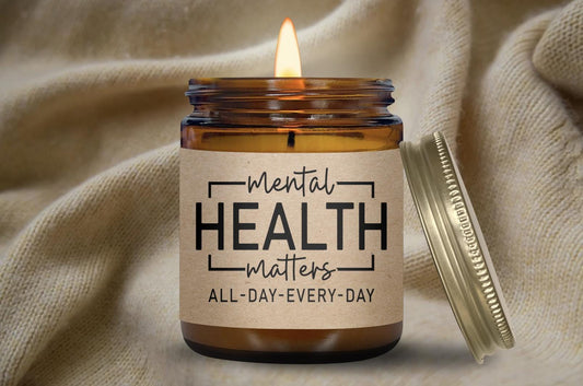 a candle with a label that says mental health matters all - day everyday