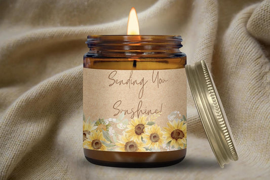 a candle with a label on it next to a jar of sunflowers sending you sunshine