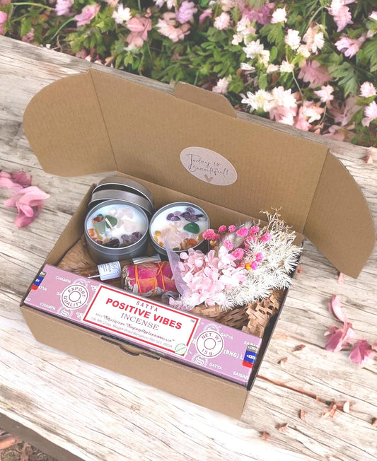 Crystal candles and incense and sage stick in a gift box